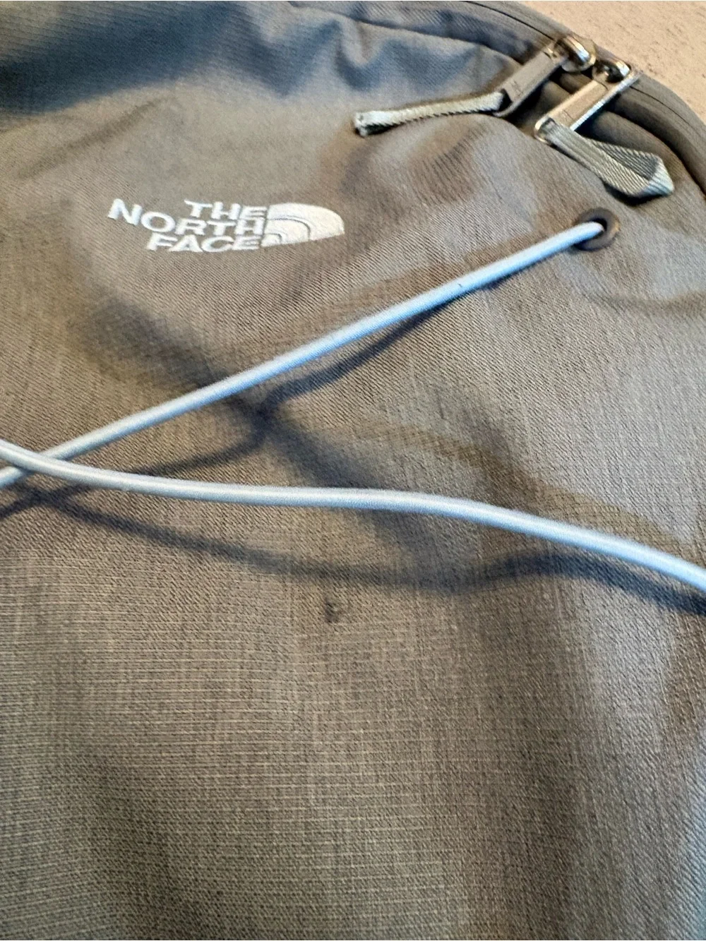 The North Face Gray Women’s Backpack with Light Blue Bungee